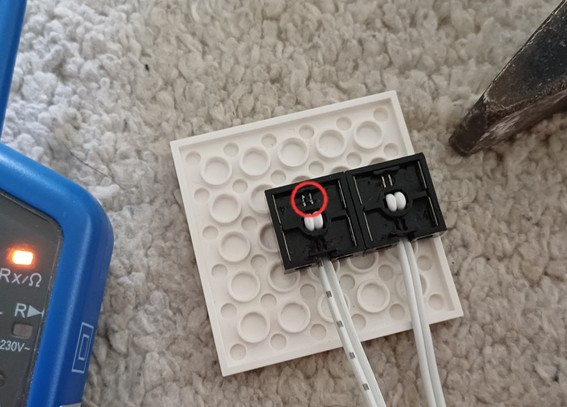 LEGO Technic 9V connector.
Two connectors on one cable. The contact pins are marked with a red circle.

On the left in the picture is one half of a two-pole voltage tester (which can also test continuity).