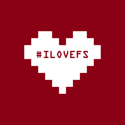 Un corazón blanco sobre fondo granate. En el corazón está inscrito el hashtag #ILOVEFS, que significa “I Love Free Software”.