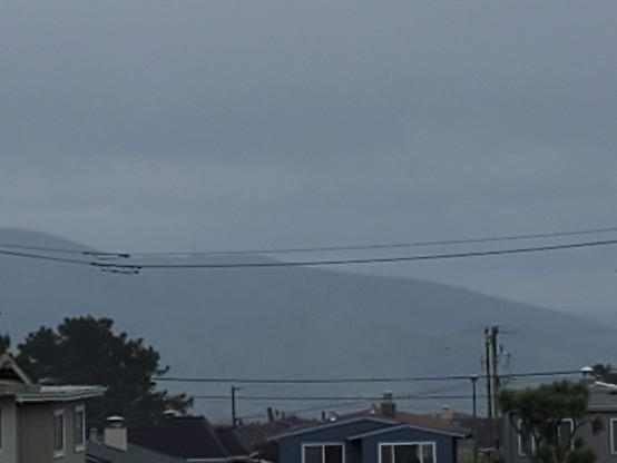 The City shrouded in a very dragonish mist, with Sutro Tower very faintly visible.