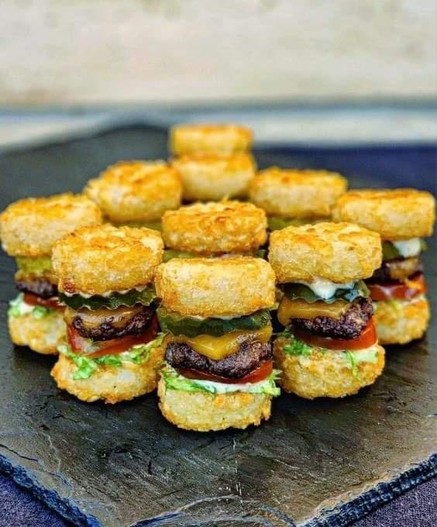 A tray of tater tot sliders - tiny cheeseburgers made with tater tots for the buns