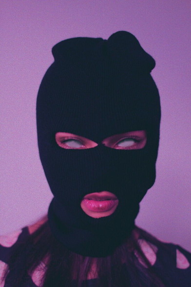 Woman in ski mask with only whites of eyes showing, no pupils