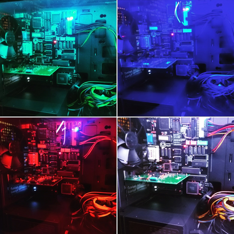 TL;DR: Four images of a computer's internal hardware illuminated by colored lights, showing cables, components, and circuitry in detail.

The image is a collage of four photographs displaying the internals of a desktop computer case under different colored lighting. Each photo has its own color theme—blue, red, green, and purple—highlighting various components. Visible parts include memory modules, the motherboard, power supply cables, and cooling fans. There's a sense of organized chaos in the routing of the cables against the rigid order of the circuit boards and components. The images offer a close-up look at the technology, each from a slightly different angle, showcasing the intricate design of the hardware.

No discernible text is present in the images that requires extraction.