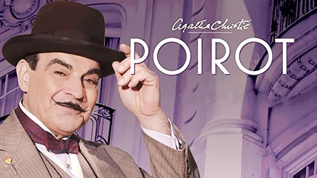 A promotional photo of actor David Suchet dressed as Agatha Christie's detective extraordinare. He's smiling in his tailored suit, tipping his hat to the viewer. His mustache is on fleek here.