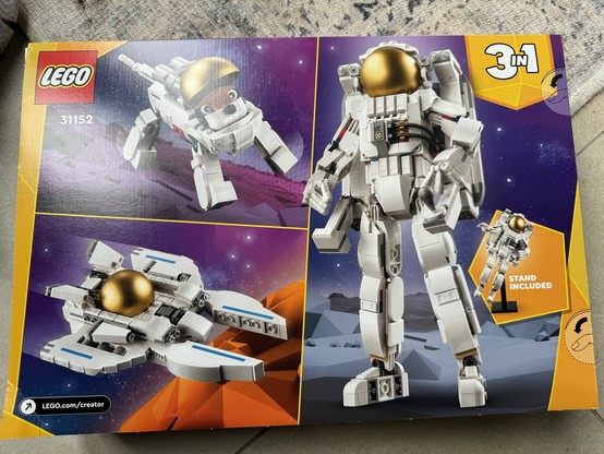 Lego Creator box. Shows the three versions that can be built. Dog, space suit, space ship. 