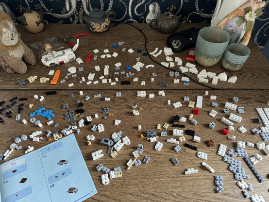 All the Lego pieces spread over the table 
