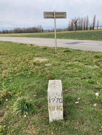 Modern border stone no. 212, with the dates 1816 and 1970 carved in the side.