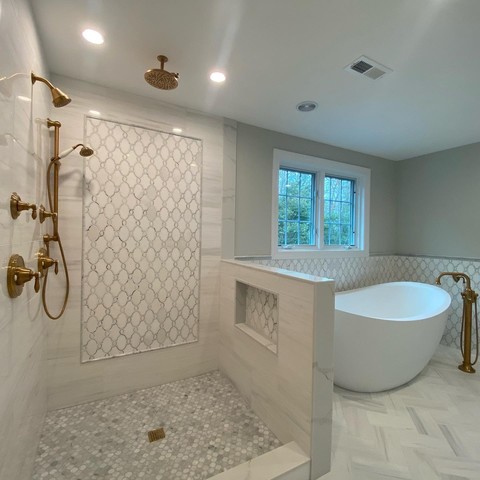 Marble Bathroom with Framed mosaic on back wall. Project done in North Reading MA