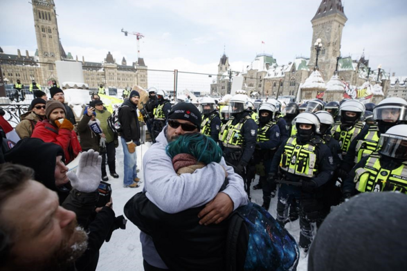 Police move in to clear downtown Ottawa near Parliament hill of protesters after weeks of demonstrations on Saturday, Feb. 19, 2022. The Liberal government is appealing a Federal Court decision that found its invocation of the Emergencies Act in 2022 was unjustified. THE CANADIAN PRESS/Cole Burston 