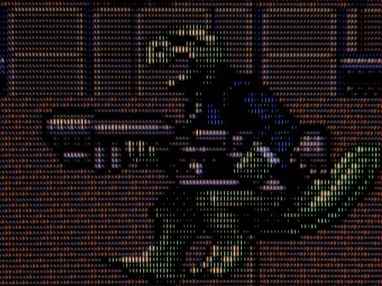 Archie, a radical 90s T-Rex, holding a gun and wearing a leather jacket and sunglasses. From the game "Dinosaurs for Hire" on the Mega Drive.