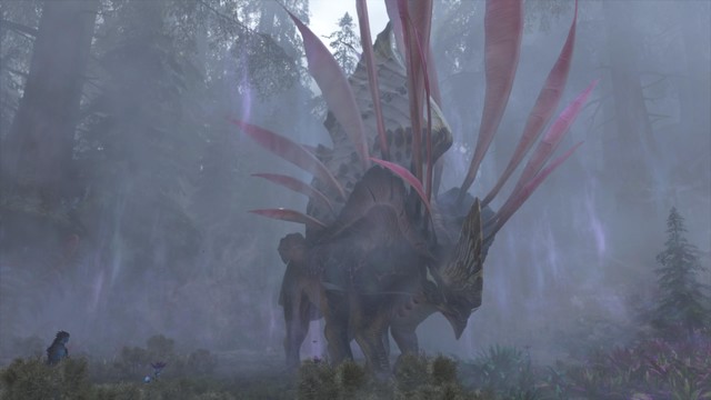 A large, mythical creature with pink feather-like appendages in a foggy, forested landscape.