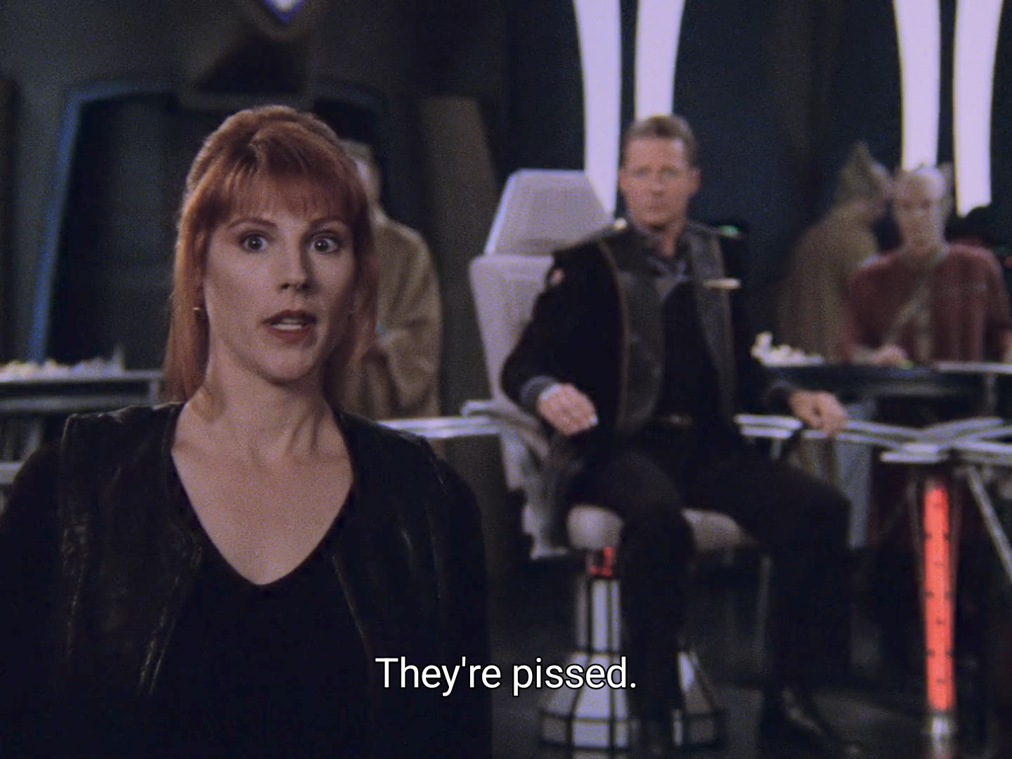 Picture of the bridge of the White Star. To the left, in the foreground, is Lyta Alexander. Near the center, in the middle distance, is Sheridan, sitting in the captain's chair. On the right, in the background, is Lennier.</p><p>The caption reads: "They're pissed."