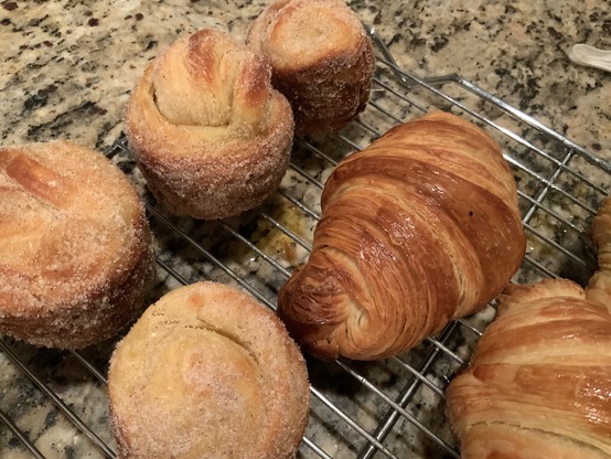 Close up of croissants on cooling rack