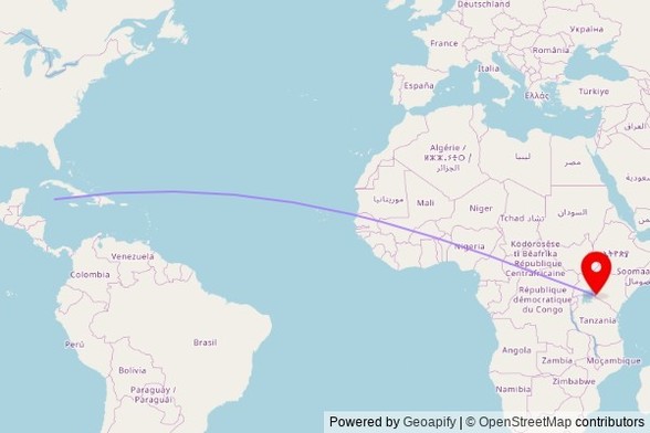 A map showing the great circle route from George Town in the Cayman Islands to a map pin at Muma SDA Church, D203, Keyian ward, Kenya