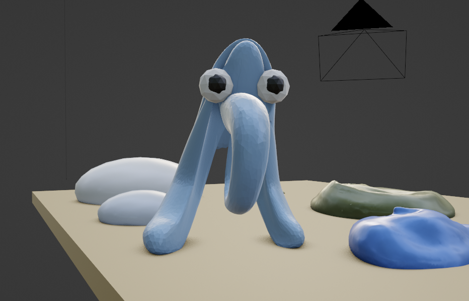 A work-in-progress view of the paint palette, with some of the paint dollops sculpted into their final shape others as placeholder squashed spheres. In the centre, the blue paint dollop has been stretched to look like some kind of bipedal creature with thick legs a proboscis, and no visible torso.It has large, bulbous eyes