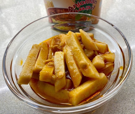 The actual contents of the can which is a bunch of wet fry-cut potatoes and scant split peas in a thin reddish sauce