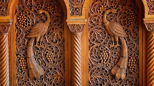 Carved window screens with peacocks.