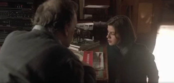 A scene with Irène Jacob as Valentine Dussaut and Jean-Louis Trintignant as Joseph Kern, as the moment of afternoon golden-hour sun passes through the window