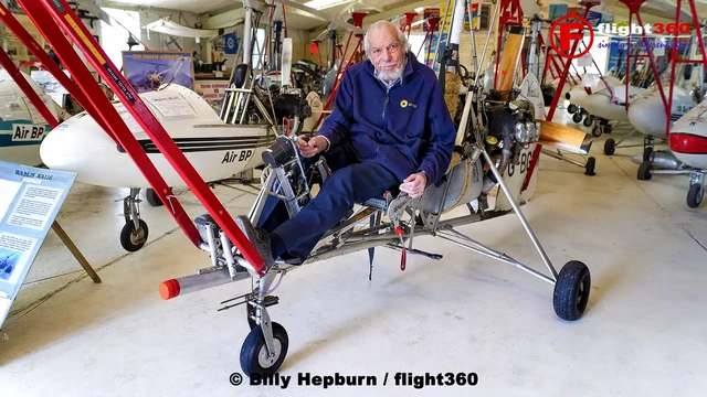 The late Wing Commander Ken Wallis sitting in his self-built WA112 Autogyro G-BGGW within his hangar at Reymerston Hall, England. 