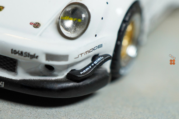 A close-up shot of Porsche RWB 930 Kamizawa by Tarmac Works in 1:64 scale with 1:64 figure on area 164