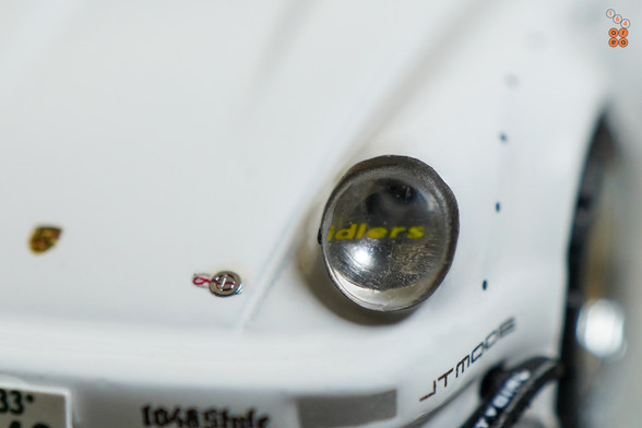 A close-up shot of Porsche RWB 930 Kamizawa by Tarmac Works in 1:64 scale with 1:64 figure on area 164