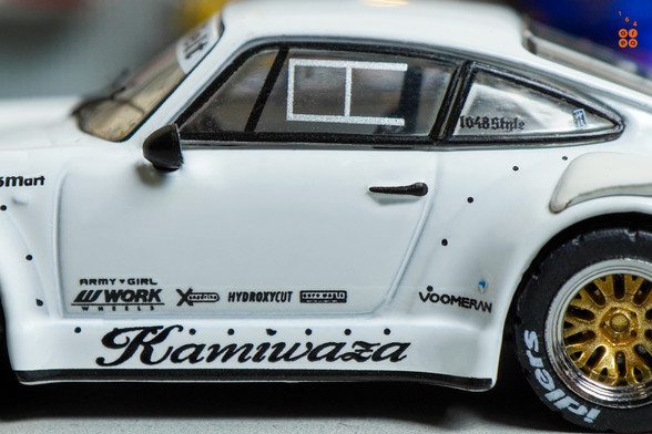 A close-up shot of Porsche RWB 930 Kamizawa by Tarmac Works in 1:64 scale with 1:64 figure on area 164