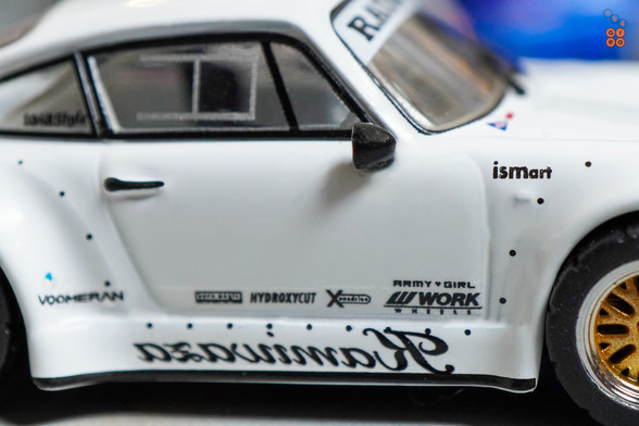 A close-up shot of Porsche RWB 930 Kamizawa by Tarmac Works in 1:64 scale with 1:64 figure on area 164