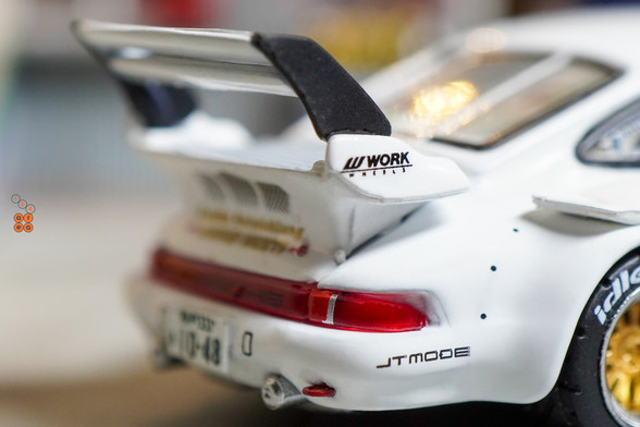 A close-up shot of Porsche RWB 930 Kamizawa by Tarmac Works in 1:64 scale with 1:64 figure on area 164