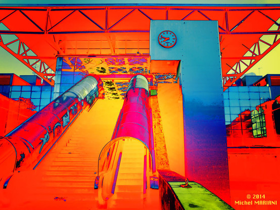 Color solarization picture: Escalator to railway station