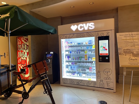 Hotel lobby vending machine with common drug store items.