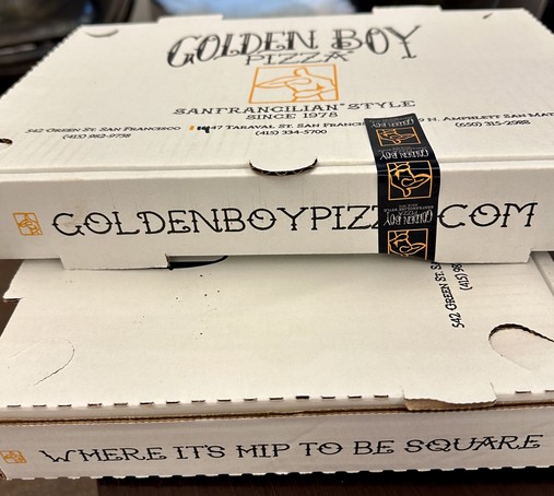 two pizza boxes from Golden Boy pizza in San Francisco