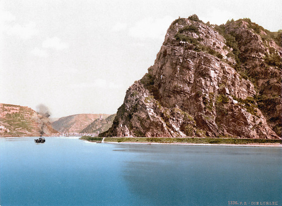 Photo of the Rhine River with the Lorelei rock formation towering over the right side of the picture from 1901