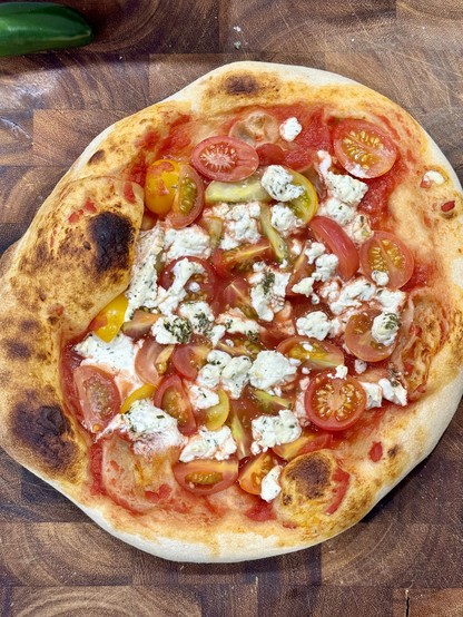 A home made pizza with herbed goat cheese 