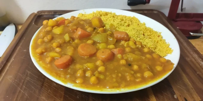 Japanese/Indian inspired curry dish with couscous.

The whole plate is half curry half couscous displayed on my square wood chopping board.