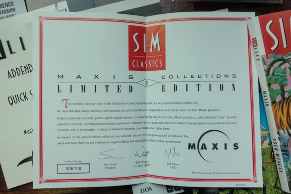 Photo of the "Maxis Collections 1 Limited Edition" certificate, which states that "This certifies that your copy of the SimClassics Collection forms part of a very special limited edition set." The certificate is signed (in print, not by hand) by Sam Poole ("President"), Will Write ("Living Legend"), and Jeff Braun ("CEO").
