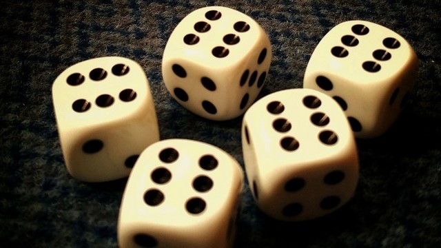 Five dice, all showing sixes.
