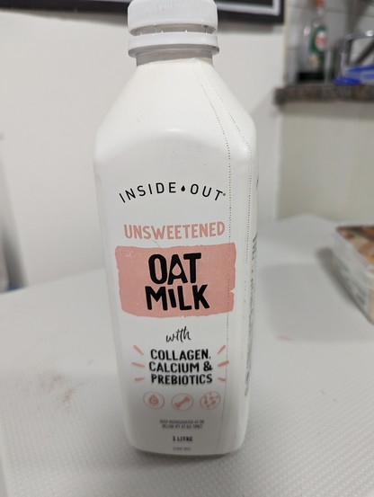 A bottle of fresh ostmilk, the brand is inside out