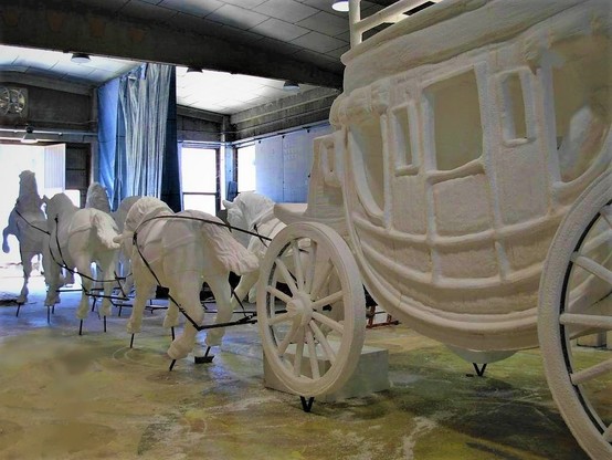 A carriage pulled by six horses made with our theming techniques.