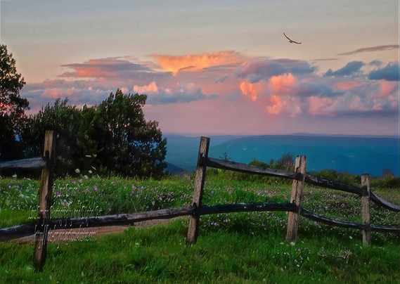 An old wooden fence cuts across a field of wildflowers on top of Blue Knob Mountain, a part of the Laurel Highlands of the Appalachians, just as the sun begins to set on a glorious spring evening. Above the distant mountain range which has caught the changing color in the hazy air a layer of curly clouds transform from soft whites to peaches and roses and blues.

"The magic of Blue Knob" is an expression my husband and his friends have used for many years. It usually refers to skiing conditions and unexpected snow storms but to me it also means the brilliance of autumn or the sweet softness of spring.

Blue Knob All Seasons Resort is located in Central Pennsylvania and includes skiing and snow boarding in winter and golfing and hiking in spring, summer and fall.

This image is my own photo (not from stock or public domain) which has been treated to a few tweaks in Photoshop. It was not created using AI - Artificial Intelligence programs.

https://fineartamerica.com/featured/spring-evening-on-top-of-blue-knob-lois-bryan.html