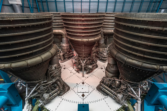 A photograph of the bottom of the Saturn V rocket on display at Kennedy Space Center, showing the five Rocketdyne F-1 engines. 