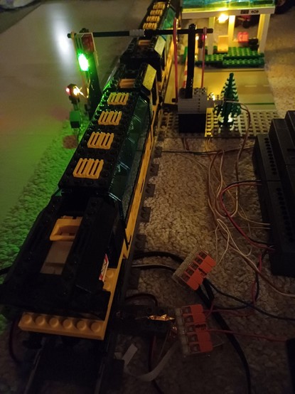 Lego train set 4559 and Lego level crossing 4532 with working traffic lights.
And many wires.