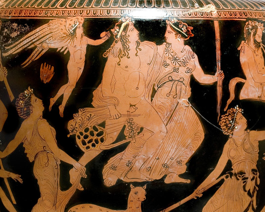A red-figure vase painting showing Dionysos and Ariadne walking arm in arm. She is holding a torch and he is holding a tortoiseshell lyre while both gaze lovingly at each other. Their retinue of maenads and satyrs surround them and winged Eros flies behind them with castagnettes or small cymbals in his hands, symbolising their love and passion for one another.