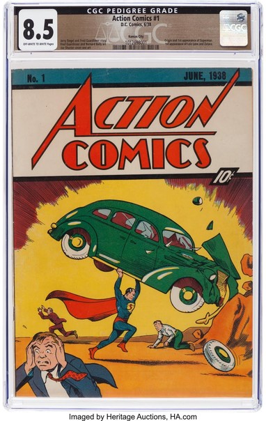 A copy of Action Comics #1 in a plastic collector sleeve (with a quality rating of 8.5). The cover art shows an early version of Superman in cape, tights, and red shorts, lifting a green 1930s car over his head. Around him, people are running and cowering. 

The cover says "Action Comics ten cents."