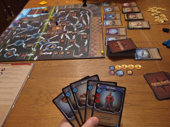 Mid-round setup of Clank! I have The Duke, three burgles and a stumble in-hand. I ended up losing 85-76 at the end, we both made it out of the dungeon.