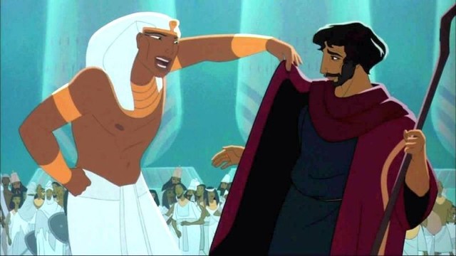 Screenshot of The Prince of Egypt. Ramses critically lifts the new cloak Moses is wearing after coming back from the desert.