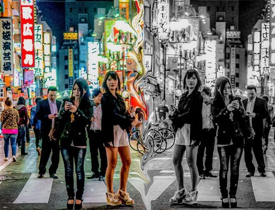 Mirror image of people in public square in Osaka, Japan.
