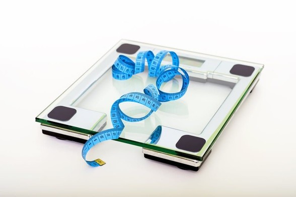 Blue Tape Measuring on Clear Glass Square Weighing Scale Bowtrol, colon cleanse, detoxification, gut health, weight loss, weight loss supplements, colon cleanse effectiveness, natural weight loss, healthy gut, Bowtrol ingredients, Bowtrol side effects, Bowtrol reviews, alternatives to Bowtrol, psyllium husk, bentonite clay