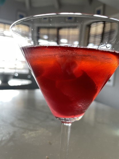 Same Martini glass, with Campari and sweet vermouth added.