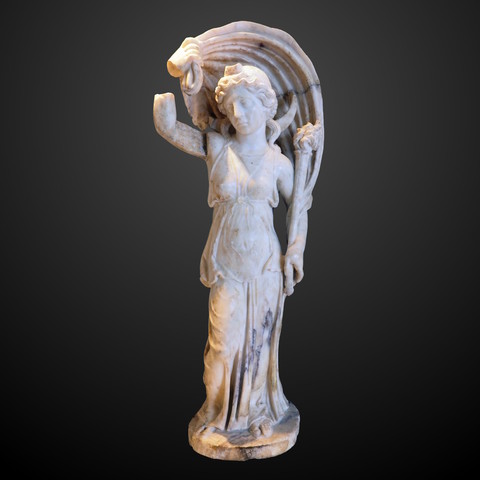 Marble statue of the Roman moon goddess Luna. She wears a peplos and her iconic cloak billowing over her head. In her left, she holds a burning torch.