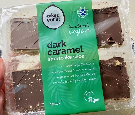 Pack of four dark chocolate caramel shortcake slices with a Vegan Society trademark