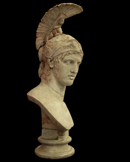 Marble bust of Ares. He wears a magnificent helmet with the crest coming from a Sphinx lying on top. Some hair flows from the helmet down his temples and there is a curly beard emerging from the temples while the chin is bare.